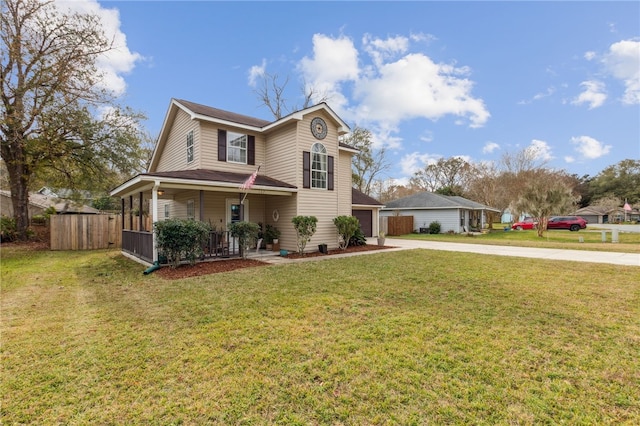 view of front property featuring covered porch and a front yard