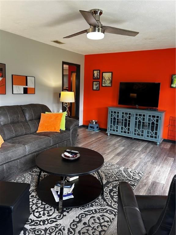 604 E Waring St, Waycross, GA 31501 - living area with ceiling fan and wood finished floors