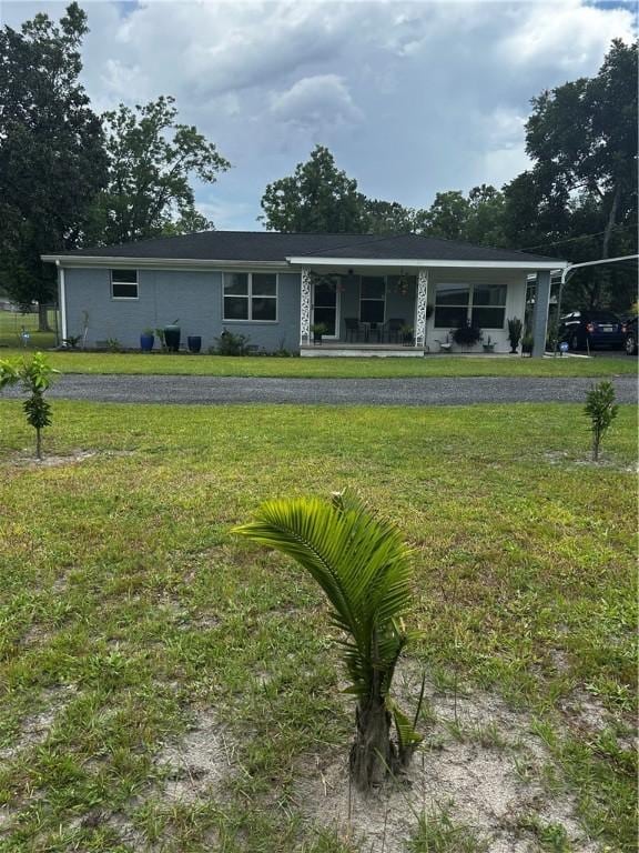 604 E Waring St, Waycross, GA 31501 - ranch-style home featuring a porch and a front lawn