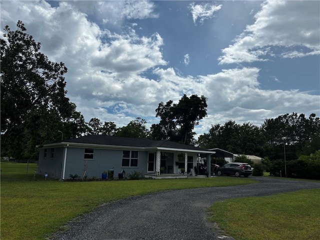 604 E Waring St, Waycross, GA 31501 - ranch-style house with covered porch, curved driveway, and a front yard