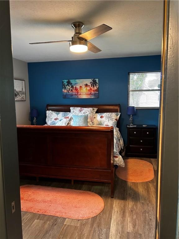 604 E Waring St, Waycross, GA 31501 - bedroom featuring wood finished floors and ceiling fan