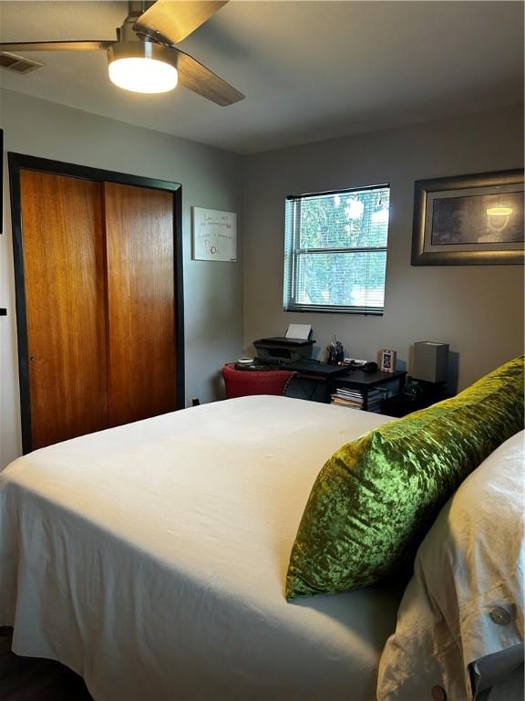 604 E Waring St, Waycross, GA 31501 - bedroom with a closet and a ceiling fan
