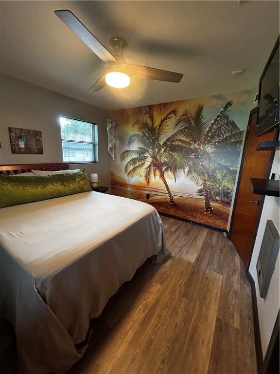 604 E Waring St, Waycross, GA 31501 - bedroom featuring wood finished floors and a ceiling fan
