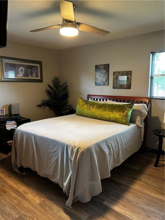 604 E Waring St, Waycross, GA 31501 - bedroom featuring wood finished floors and a ceiling fan