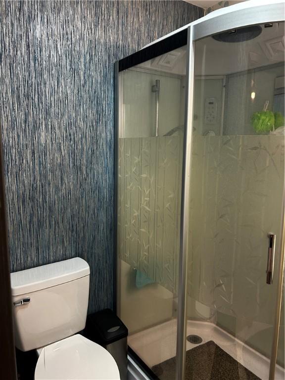 604 E Waring St, Waycross, GA 31501 - bathroom with toilet and a shower stall