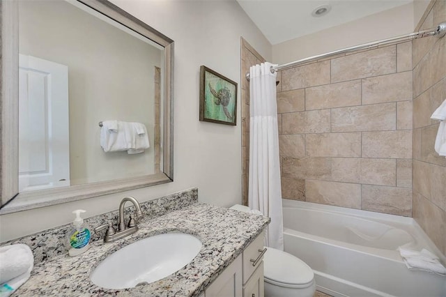 full bathroom featuring vanity, toilet, and shower / bathtub combination with curtain