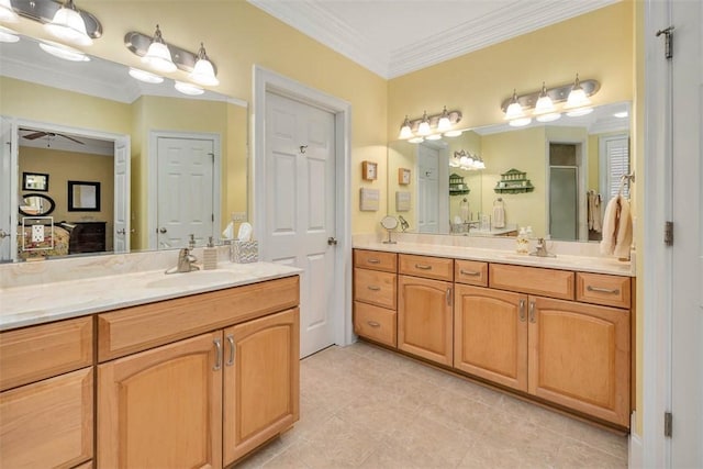 bathroom featuring a ceiling fan, tile patterned flooring, a shower stall, two vanities, and a sink