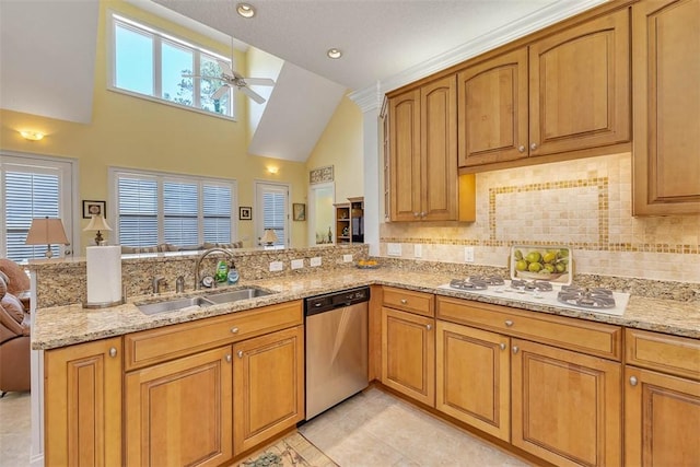 kitchen featuring white gas cooktop, a sink, a peninsula, a ceiling fan, and stainless steel dishwasher