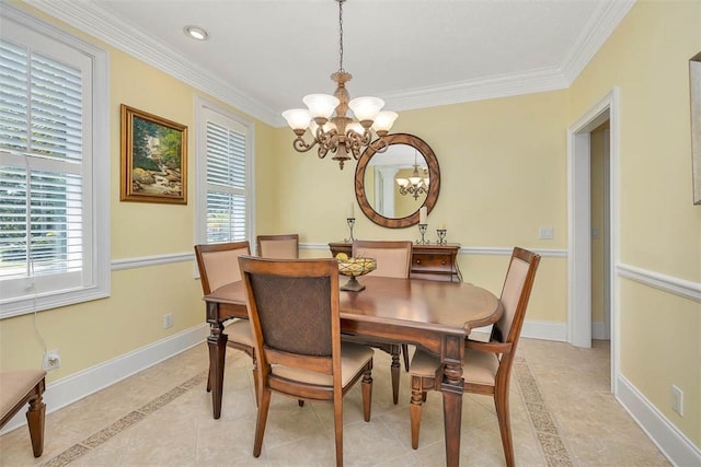 dining room featuring baseboards, a chandelier, ornamental molding, and light tile patterned floors