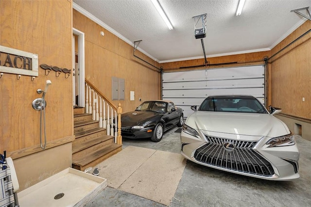 garage with wooden walls and a garage door opener