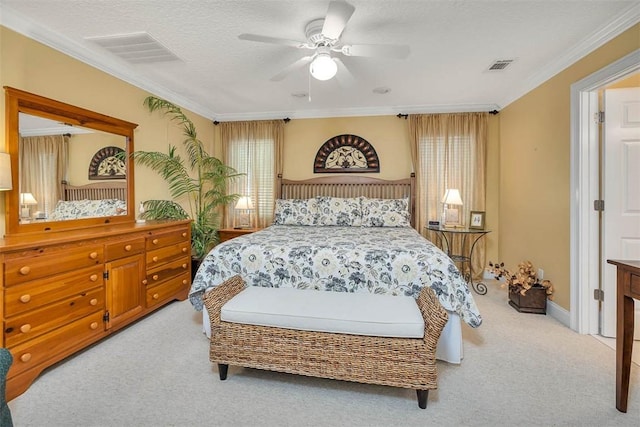 carpeted bedroom with crown molding, baseboards, a ceiling fan, and visible vents