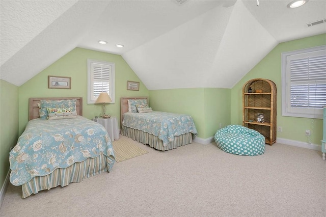 bedroom with visible vents, vaulted ceiling, baseboards, carpet flooring, and recessed lighting