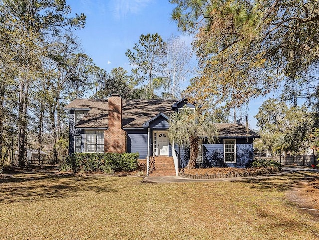 ranch-style home with a front lawn