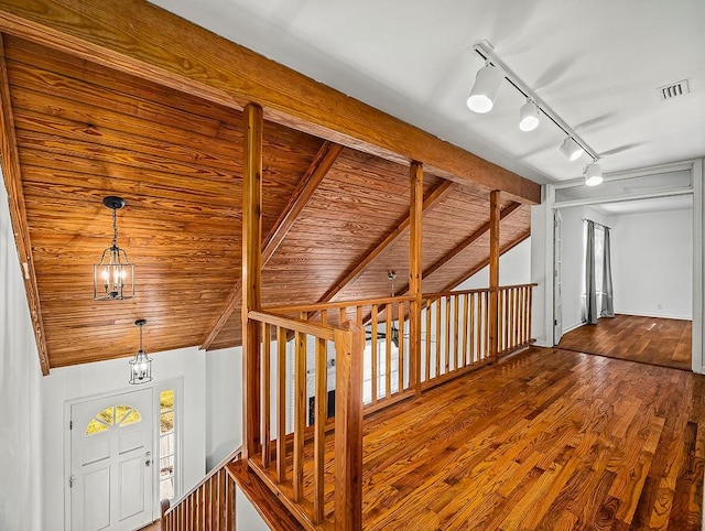 additional living space featuring wooden ceiling, hardwood / wood-style floors, and vaulted ceiling with beams