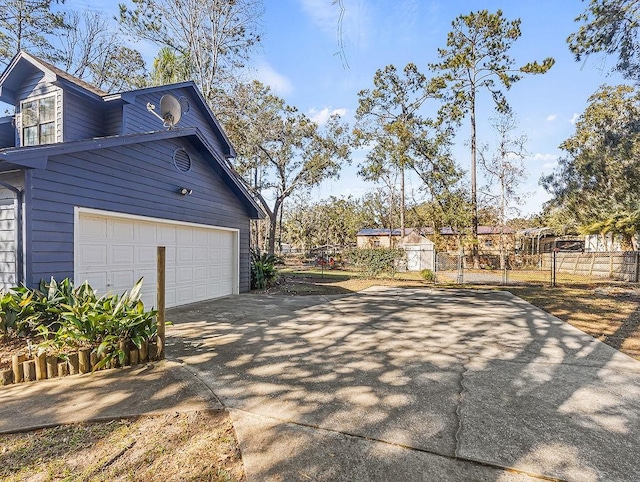 view of side of property featuring a garage