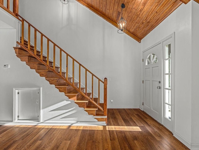 entryway with hardwood / wood-style flooring, wooden ceiling, and high vaulted ceiling