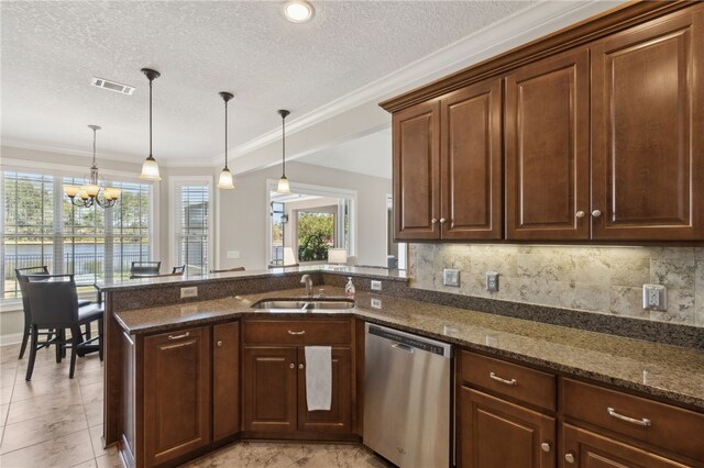 kitchen featuring a chandelier, dark stone counters, a sink, dishwasher, and a peninsula
