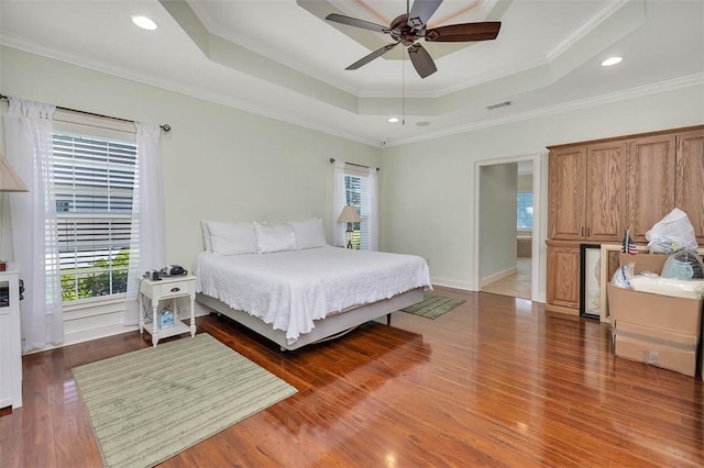 17 Willow Ct, Brunswick, GA 31523 - bedroom with a tray ceiling, multiple windows, wood finished floors, crown molding, and recessed lighting
