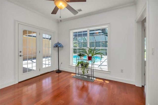 17 Willow Ct, Brunswick, GA 31523 - doorway featuring wood finished floors, baseboards, ceiling fan, and ornamental molding