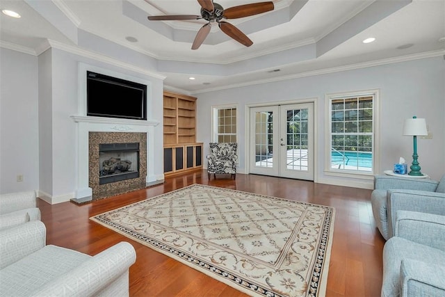 17 Willow Ct, Brunswick, GA 31523 - living room with french doors, a raised ceiling, ceiling fan, wood finished floors, and ornamental molding