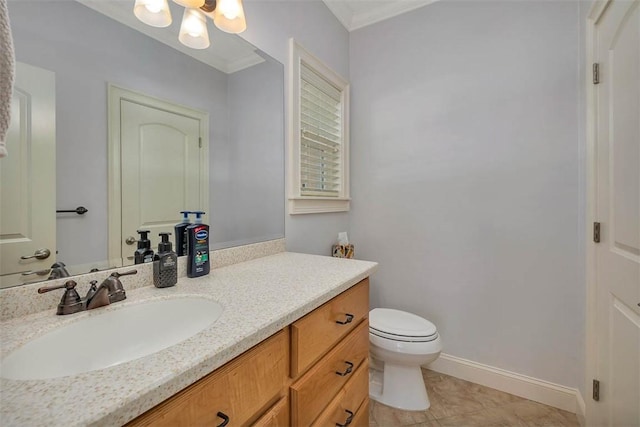 17 Willow Ct, Brunswick, GA 31523 - bathroom with vanity, toilet, ornamental molding, baseboards, and tile patterned flooring