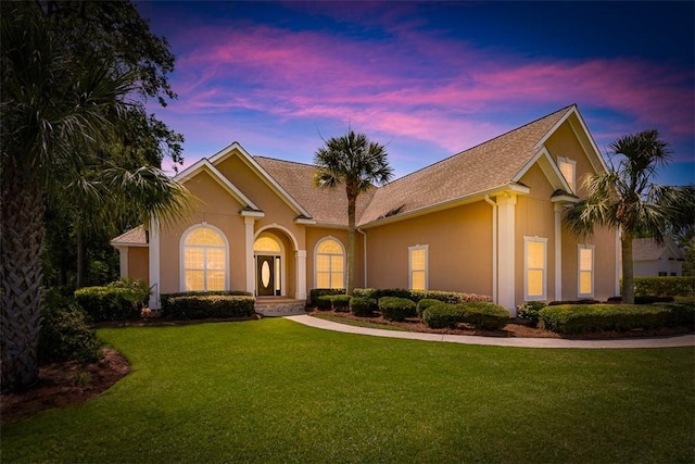 17 Willow Ct, Brunswick, GA 31523 - view of front of house with a lawn and stucco siding