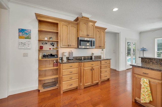 17 Willow Ct, Brunswick, GA 31523 - kitchen featuring stainless steel microwave, dark wood-type flooring, open shelves, dark stone countertops, and french doors