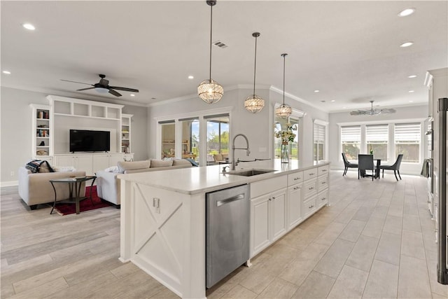 107 Cason Noah Dr, Kingsland, GA 31548 - kitchen featuring ceiling fan with notable chandelier, sink, hanging light fixtures, stainless steel dishwasher, and an island with sink