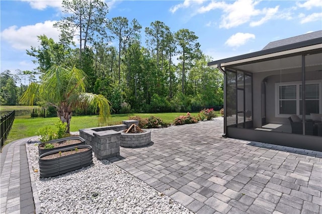 107 Cason Noah Dr, Kingsland, GA 31548 - view of patio / terrace featuring a sunroom and a fire pit