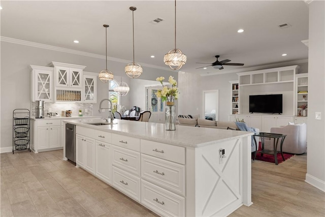 107 Cason Noah Dr, Kingsland, GA 31548 - kitchen with ceiling fan, a center island with sink, white cabinets, and decorative light fixtures
