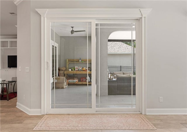 107 Cason Noah Dr, Kingsland, GA 31548 - entryway featuring light wood-type flooring, ceiling fan, and ornamental molding