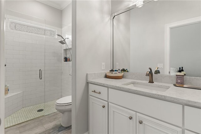 107 Cason Noah Dr, Kingsland, GA 31548 - bathroom with crown molding, a shower with door, vanity, and toilet