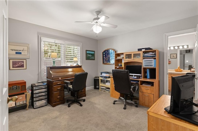 office with ceiling fan and light carpet