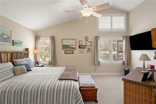 carpeted bedroom featuring ceiling fan and lofted ceiling