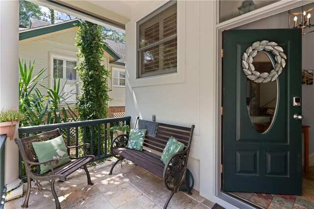 view of exterior entry with a porch