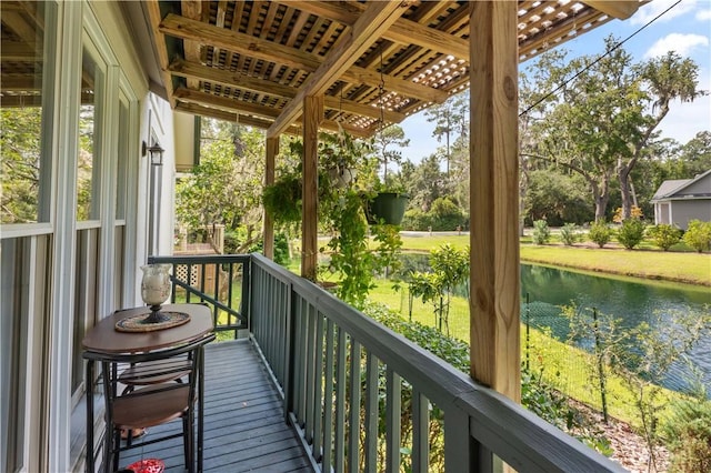 balcony featuring a water view