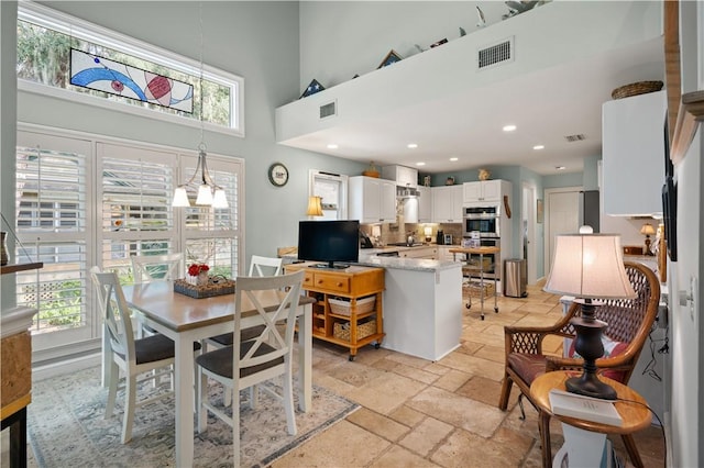 dining room featuring a high ceiling