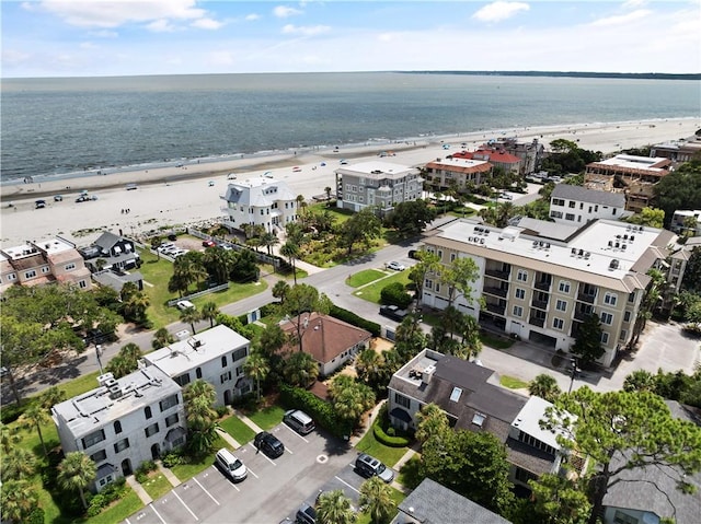 aerial view with a beach view and a water view