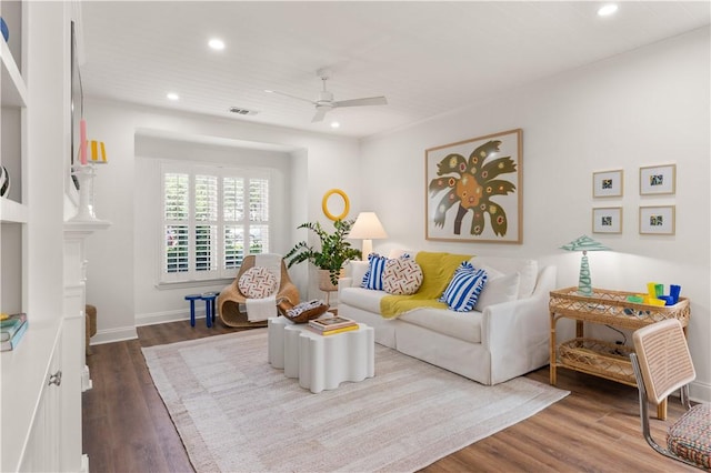 living room with hardwood / wood-style flooring and ceiling fan