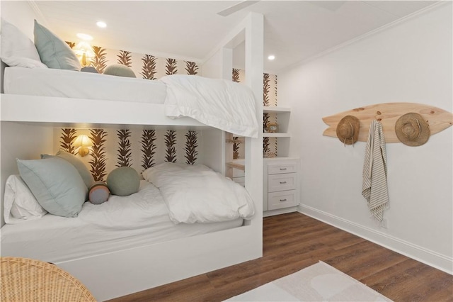 bedroom featuring ceiling fan, crown molding, and dark wood-type flooring