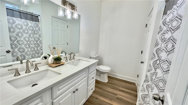 bathroom featuring a shower with curtain, vanity, toilet, and wood-type flooring