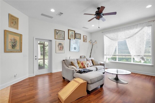 living area with baseboards, visible vents, a ceiling fan, wood finished floors, and recessed lighting