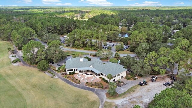 birds eye view of property with a view of trees