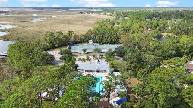 birds eye view of property with a forest view