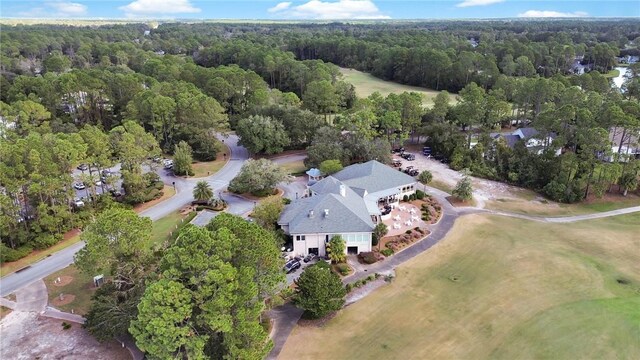 bird's eye view featuring a wooded view