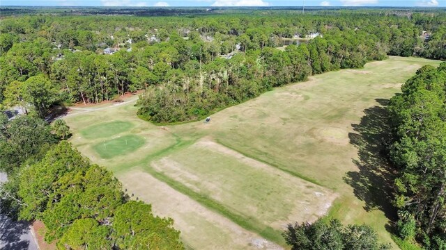 birds eye view of property with a wooded view