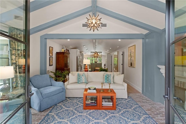 living room featuring vaulted ceiling with beams and hardwood / wood-style flooring