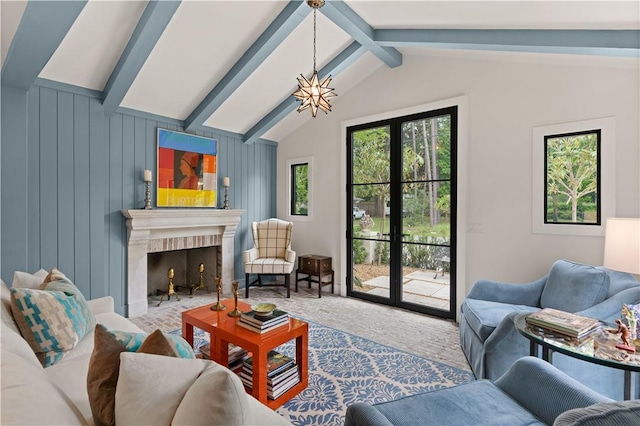 living room with vaulted ceiling with beams, carpet floors, an inviting chandelier, and wood walls