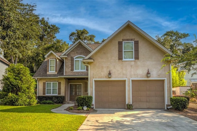 front of property with french doors, a front yard, and a garage