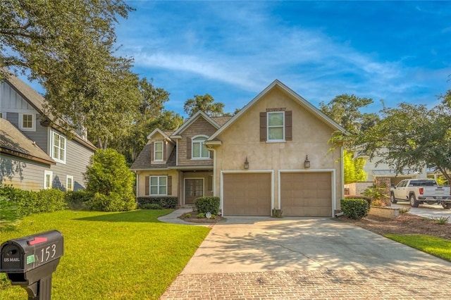 front facade with a garage and a front lawn